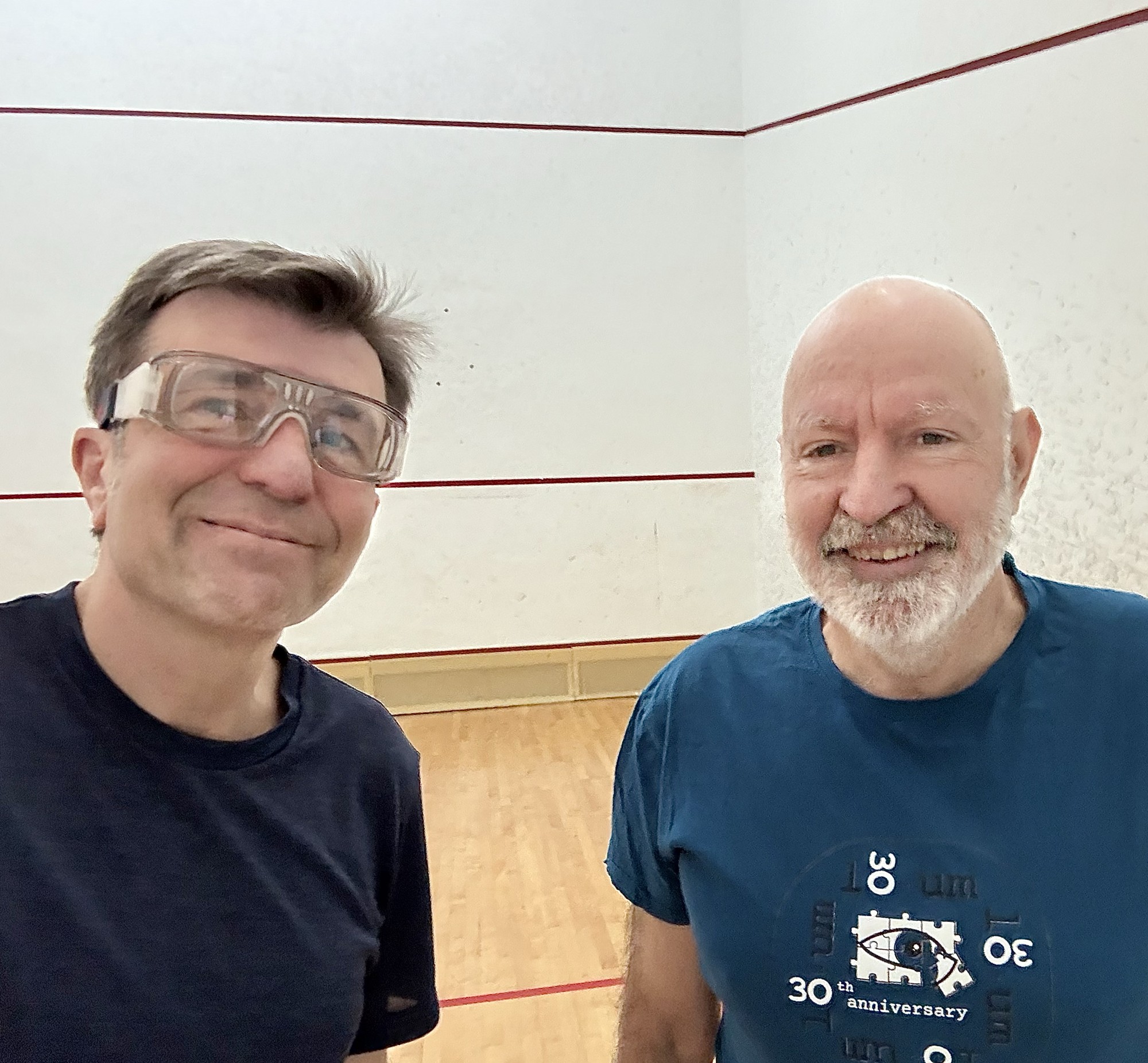 Pablo Artal and Professor Miguel Ortuño on a squash court.
